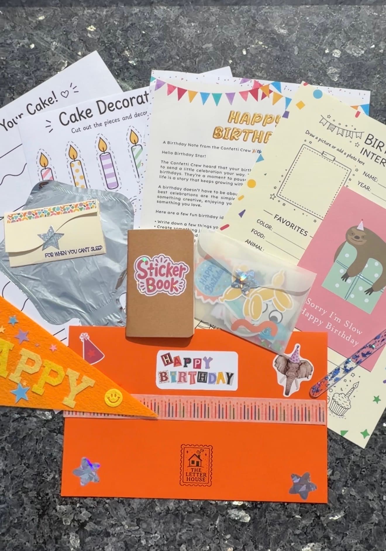 A birthday mail package with activities, stickers, and surprises