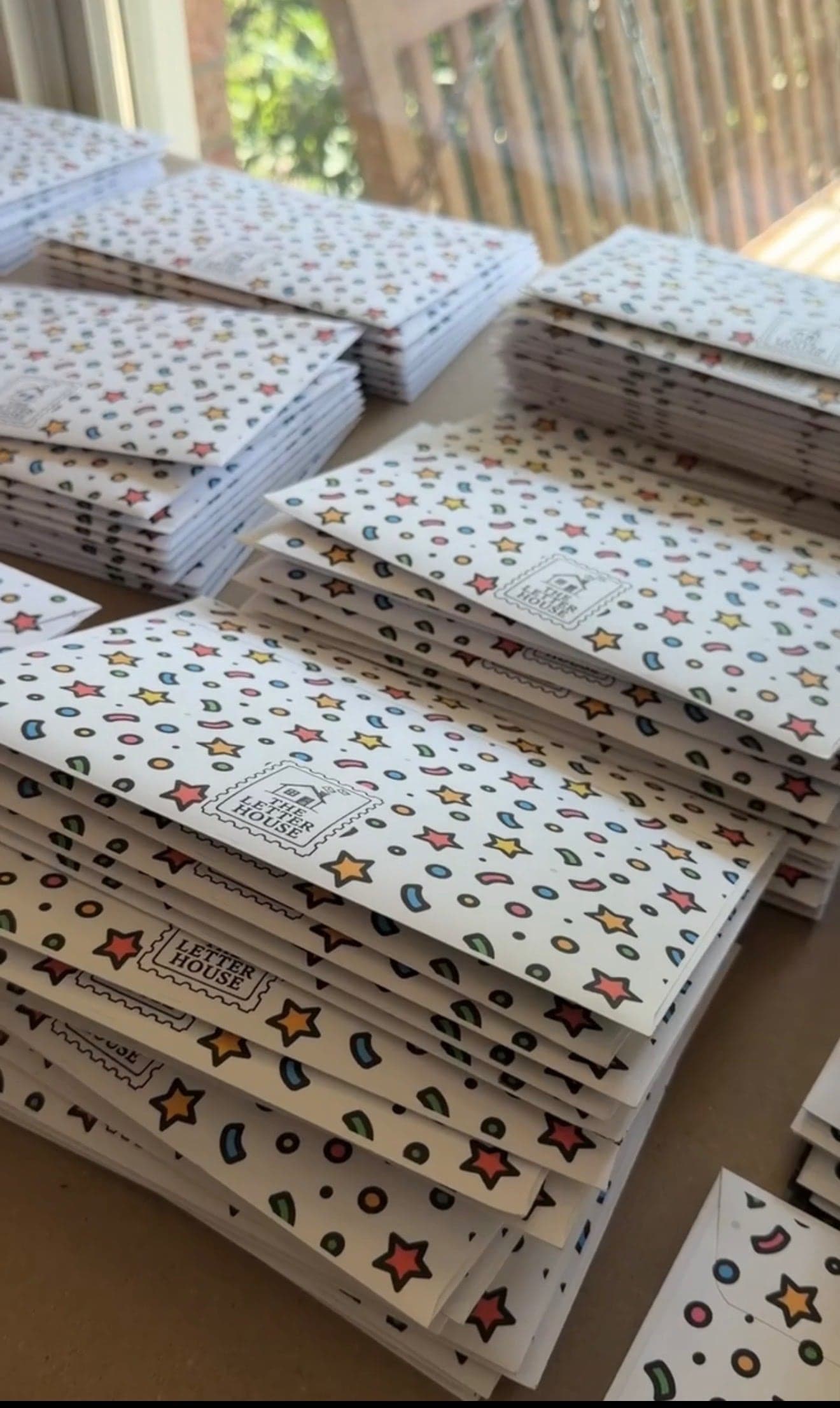 Stacks of patterned Letter House mail ready to send